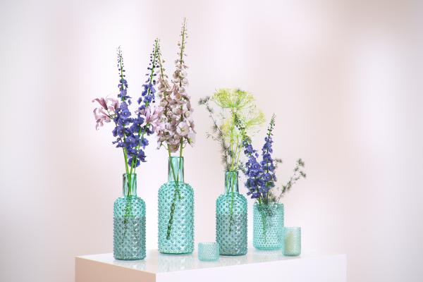 Flowers in decorative glass bottles